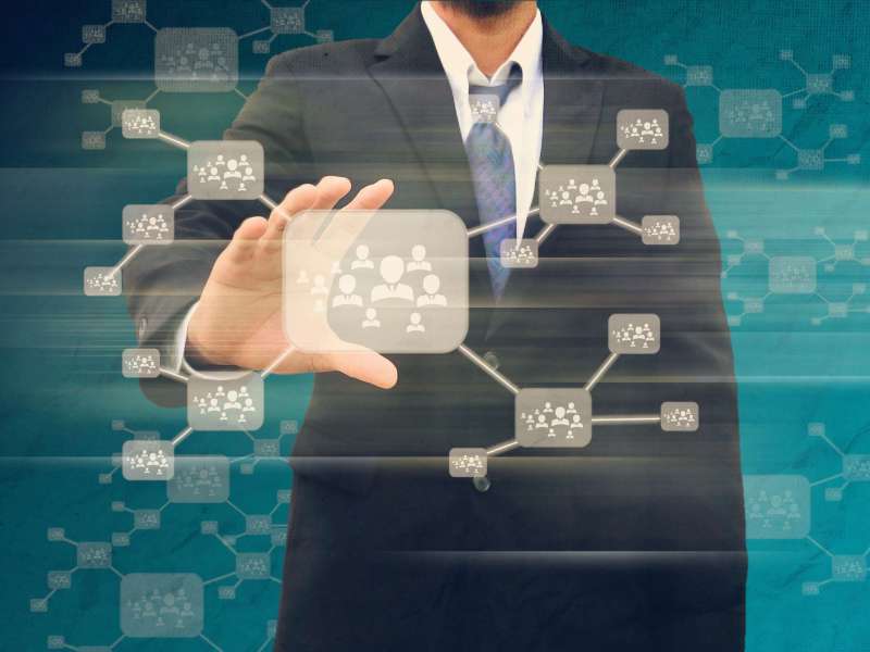 Businessman holding icon of social network