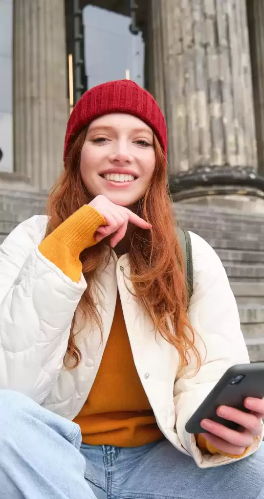 portrait-young-urban-girl-red-hat-sits-stairs-near-museum-holds-mobile-phone-connects-pu
